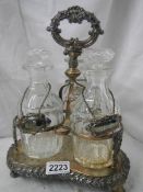 A Victorian 3 bottle tantalus in good condition.