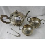 A 3 piece hall marked silver tea set and sugar nips, 684 grams.