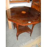 An Edwardian mahogany inlaid octagonal table.