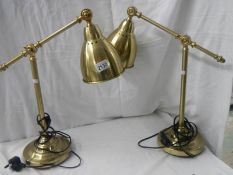 A pair of good quality mid 20th century adjustable table lamps.