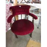 A red dralon covered bedroom chair.