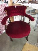 A red dralon covered bedroom chair.