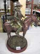 A good figure of John Wayne on a horse.