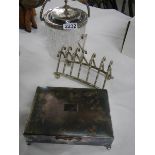 A cut glass biscuit barrel, a toast rack and a silver plate cigarette box.