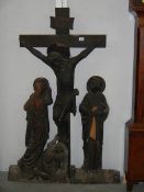 A carved wood crucifix. Approximately 4ft tall.