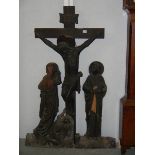 A carved wood crucifix. Approximately 4ft tall.