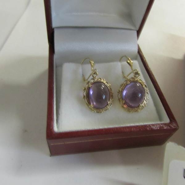 A pair of amethyst set ear pendants in yellow metal together with an amethyst set bracelet with - Image 3 of 3