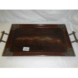 A Chinese rosewood tray with silver embellishments including dragon in centre.