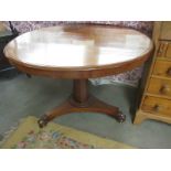 A Victorian mahogany circular tip top table on platform base, 40" diameter.