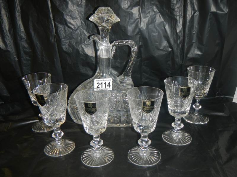 An unusual shaped Edinburgh crystal decanter and 6 Edinburgh crystal glasses.