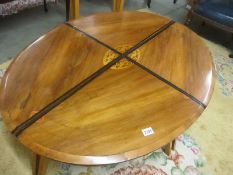 A Victorian loo table top converted in to 4 smaller tables.