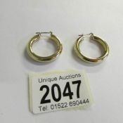 A pair of hoop earrings in 9ct gold, 5 grams.