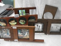 A collection of coloured glass lantern slides in mahogany frames.