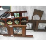 A collection of coloured glass lantern slides in mahogany frames.