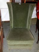 An Edwardian wing arm chair.