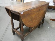 An oak gate leg table.