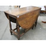 An oak gate leg table.