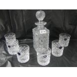 An old style hobnail cut glass decanter and a set of 6 Stuart crystal whisky tumblers.