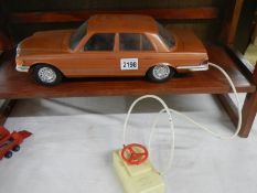 A large 1980's Rico battery operated remote control Mercedes 450 car.