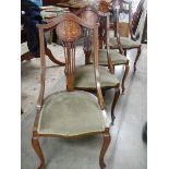 A set of 4 mahogany inlaid chairs.