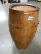 An old ship's whisky barrel with copper bands, 16.5" tall.