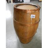 An old ship's whisky barrel with copper bands, 16.5" tall.