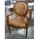 A French gilded arm chair.