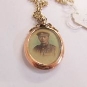 An early 20th century first world war period sweetheart locket of an young man in officer's uniform,