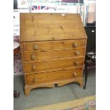 A good quality mid 20th century pine bureau with fitted interior, 33" wide.