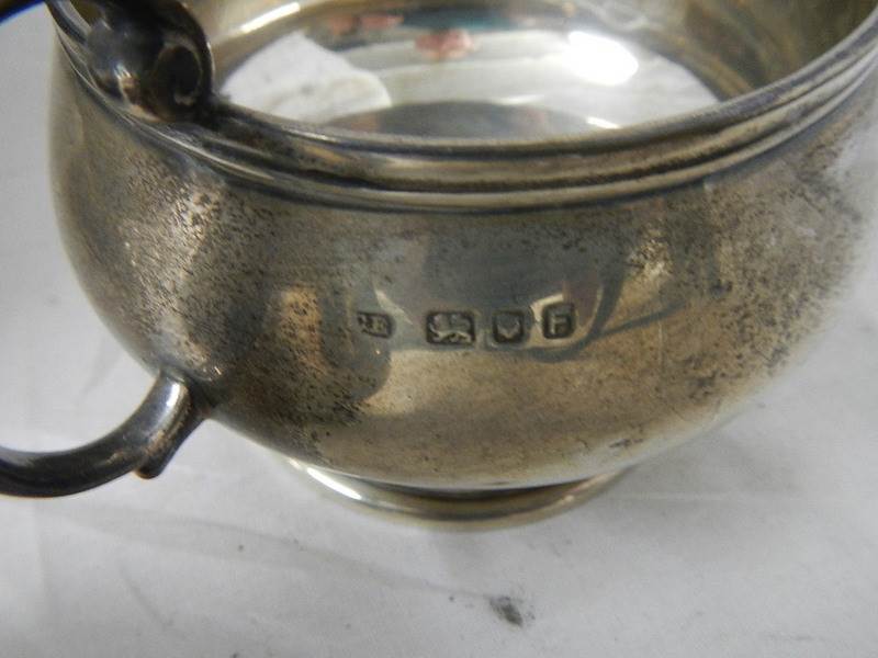 A 3 piece hall marked silver tea set and sugar nips, 684 grams. - Image 4 of 4