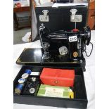 A Singer featherweight portable sewing machine, model No.