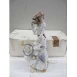 A large NAO figure of a Lady with Umbrella and Hat on a windy day (with box)