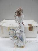 A large NAO figure of a Lady with Umbrella and Hat on a windy day (with box)