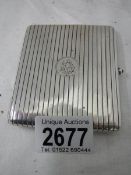 A silver plated cigarette case