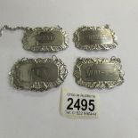 4 silver plate spirit labels.