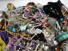 A large quantity of unsorted costume jewellery.