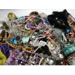 A large quantity of unsorted costume jewellery.