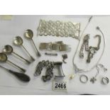 A mixed lot of silver items including silver spoons, necklace, bracelet,