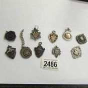 10 silver watch fobs.