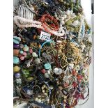 A large quantity of unsorted costume jewellery.