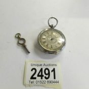 A Ladies Chester silver fob watch with key.