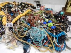 A large quantity of unsorted costume jewellery,