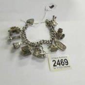 A very good quality 1970's charm bracelet with 11 charms in total including 4 opening,