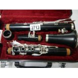 A good quality silver plated "Jupiter" cased clarinet with spare reed.