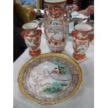 A pair of Chinese vases, a larger vase and a plate.