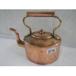 A Victorian oval copper kettle.