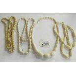 4 ivory necklaces.