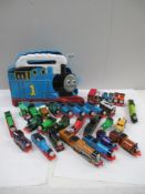 Box containing various ERTL Thomas Tank series vehicles including a carry case