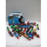 Box containing various ERTL Thomas Tank series vehicles including a carry case