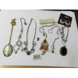 A mixed lot of pendants, necklaces etc.